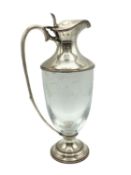 A sterling silver claret jug with etched leaf and vine decoration. JM London, 1998. 26cm(h)