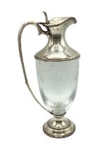 A sterling silver claret jug with etched leaf and vine decoration. JM London, 1998. 26cm(h)