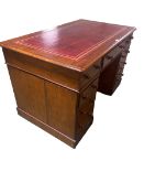 Traditional mahogany kneehole pedestal desk with tooled red leather to top 75cm high, top 71cm/