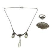 Three pieces of Marcasite set jewellery to include pearl and quartz set broach, pearl set dress ring