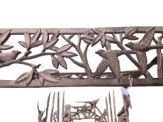 A free standing decorative metalwork boot rack, as found, and for assembly
