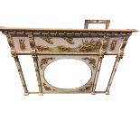 Large tryptic overmantel mirror, central oval plate flanked by two rectangular bevelled plates,