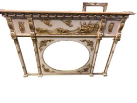 Large tryptic overmantel mirror, central oval plate flanked by two rectangular bevelled plates,