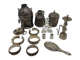 A collection of Middle Eastern silver and white metal items to include ornamental water jugs, bangle