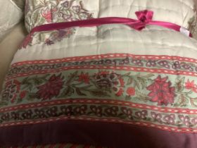 Quantity of decorative cushions and a bed spread