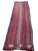 A Kilim style runner, the red and blue stripes and kilim stylized pattern to end of the rug, 109/