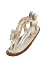 A modern composite statue of a reclining female nude, with two lurcher/hounds, as found with some
