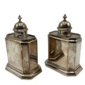 A pair of Britannia sterling silver tea caddys. Hexagonal shape with stepped bases. With finialed