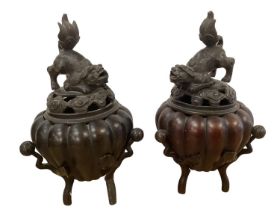 Two bronze oriental style censors, surmounted with mythical beasts, 19cmH