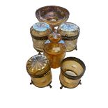 Collection of amber glass items to include gilt brass mounted lidded jars and opalescent taza