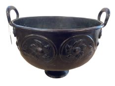 A large bronze and embossed two handled bowl, on raised circular plinth base, 25cmH x 24cm