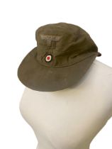 A WWII German Afrika Corps M.40 field cap, standard red lining marked KARL HALFAR BERLIN 1942.