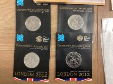 A collection of 20th century commemorative and collectible coins and stamps and bank notes