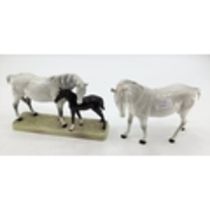 A Beswick model of a dapple grey mare and bay foal on an oblong