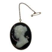 A yellow metal hardstone oval cameo of a classical maiden with a safety chain 4cm x 3.4cm