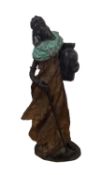 A cast bronze model of a North African lady carrying a water vessel, 29cmH