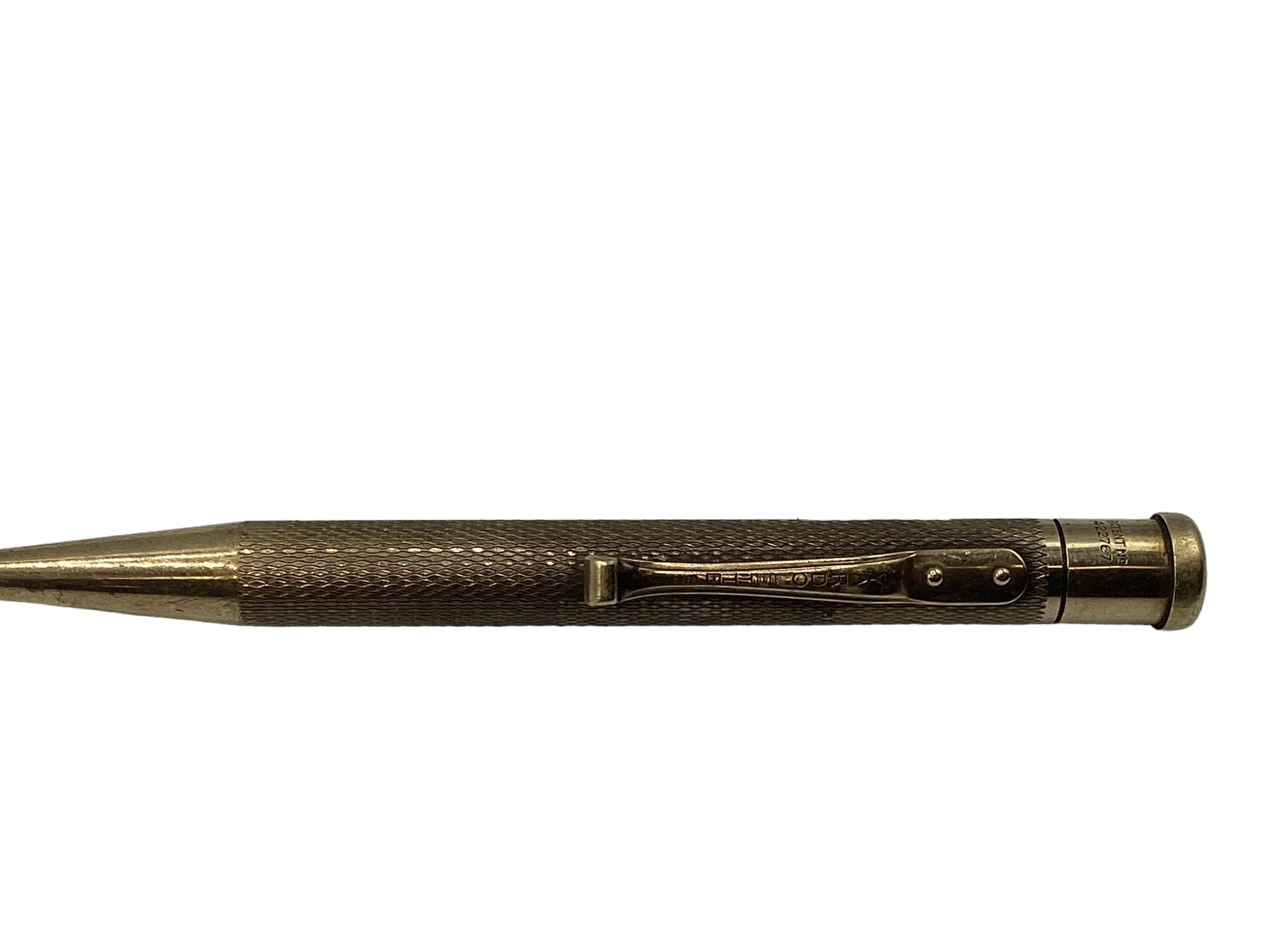 A 9ct gold propelling pencil with engine turned decoration. - Image 2 of 4