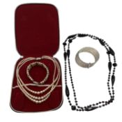 A collection of costume jewellery to include faux pearl necklace and bracelet set, 6 bangle white