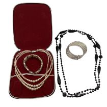 A collection of costume jewellery to include faux pearl necklace and bracelet set, 6 bangle white