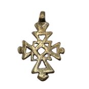 An unmarked yellow metal Coptic style crucifix pendant 8 g