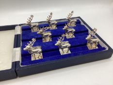 A set of Sterling silver menu holders of cast metal stags, by Camelot silver wear, Sheffield,