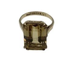 A 9 ct gold and Citrine set ring Emerald cut citrine in 4 claw setting in open work mount, 3.8 g