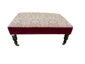 Rectangular upholstered stool on mahogany turned legs with brass castors 94 cm W x 64 cm D x 45 cm H