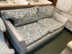 A small blue and cream two seater sofa (some wear and fading to fabric)