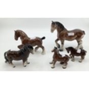 A collection of Beswick shire horses, various sizes (5)