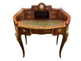 Louise XVI style kingwood and ormulu mounted ladies writing desk with central inset clock on sabre