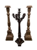 Pair of wooden floor standing candlesticks (76cm H) together with a heavy bronze 6 branch table