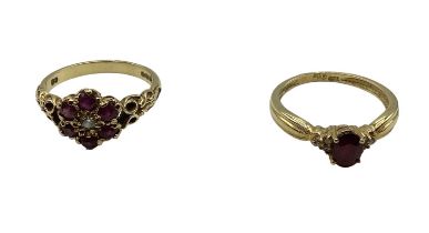 Two 18 ct gold ruby and diamond set rings, first set with central brilliant cut diamond and surround