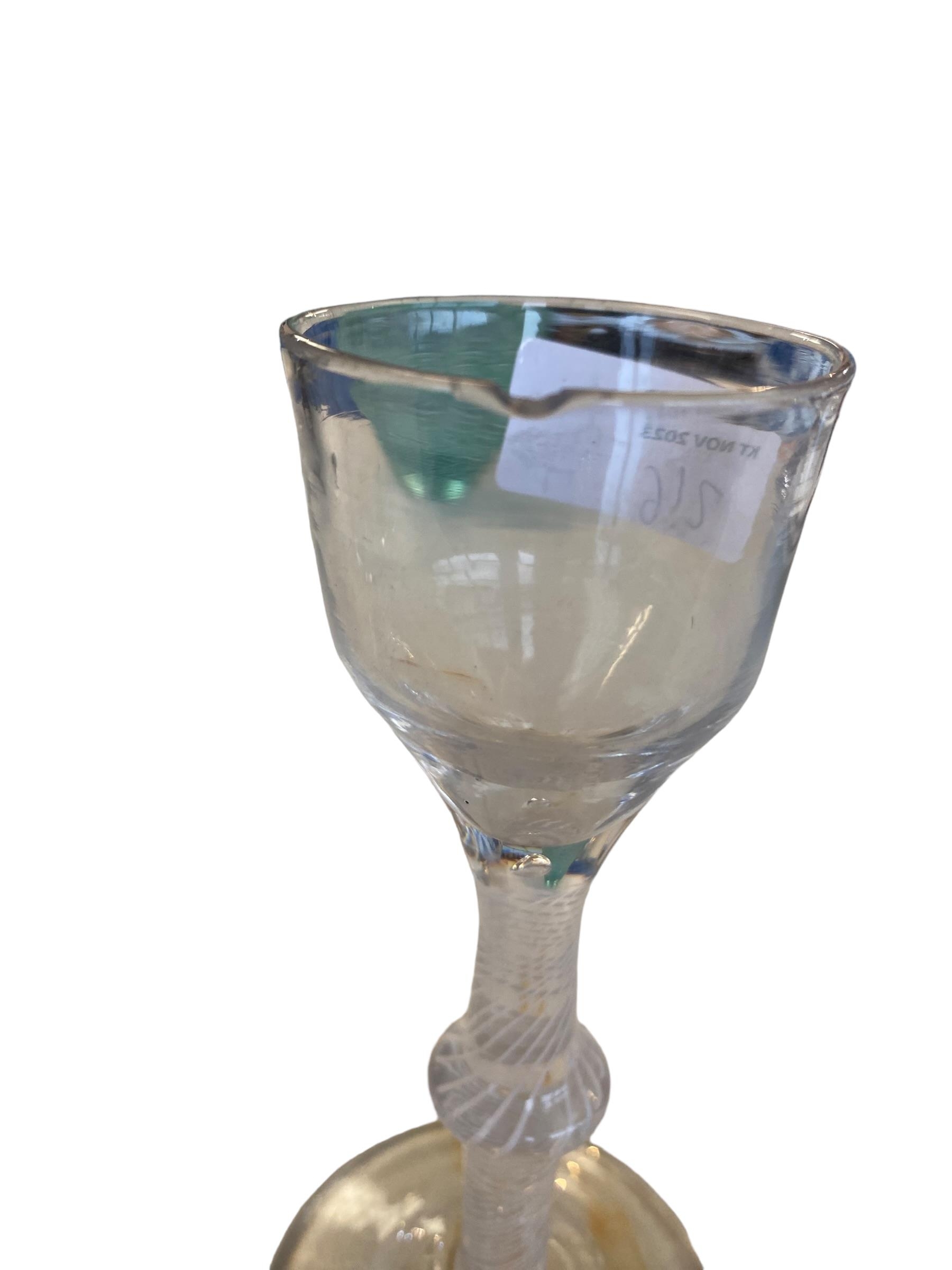 Two C18th spiral stem wine glasses, the smaller with chip to rim, 15 cm (tallest) and three later - Image 2 of 4