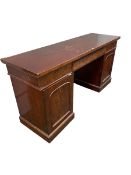 William IV mahogany sideboard with three drawers to the top, on pedestal supports opening to