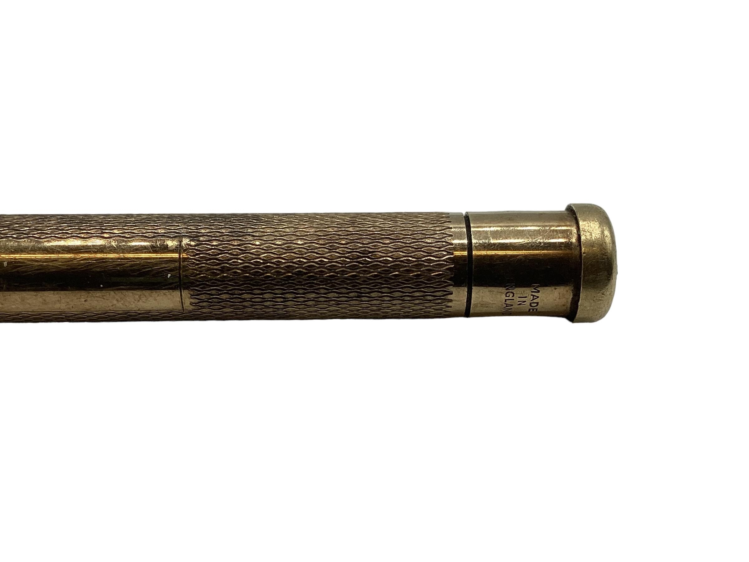 A 9ct gold propelling pencil with engine turned decoration. - Image 4 of 4