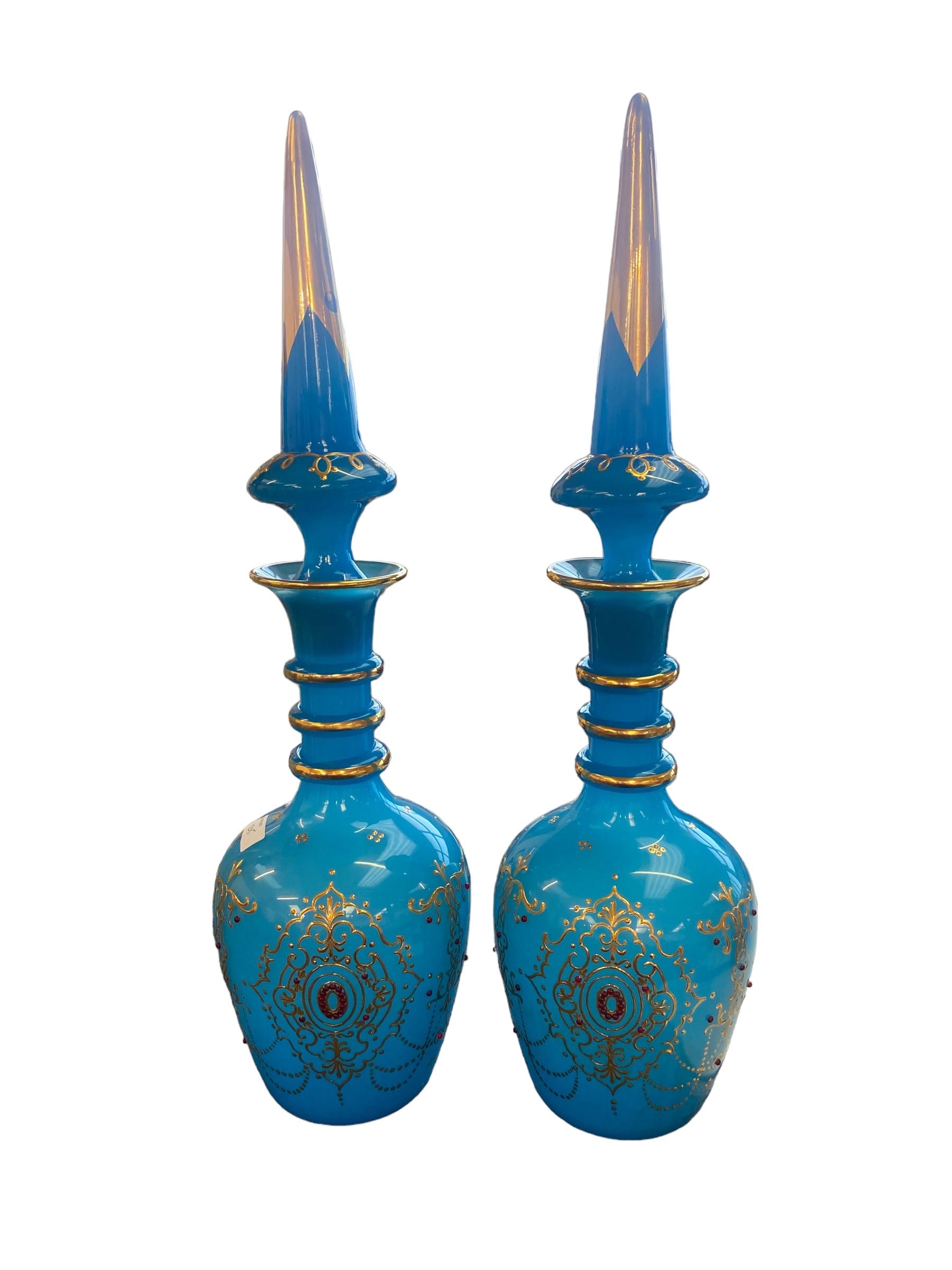 Pair of bohemian opague blue and gilt lidded vases with red jewelled enamel decoration 59 cm H