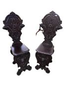 Pair of heavily carved high back Sgabello style Italian hall chairs 123 cm H x 47 cm W x 46 cm D