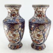 A pair of Japanese vases, decorated in the Imari Palette, red stamp to base, hand painted, 38.5cmH
