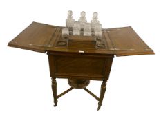 MAPPIN & WEBB: A fitted oak drinks cabinet, the top opening to reveal 3 crystal decanters, and