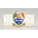 Cricket bag. Small crested china cricket bag with colour emblem for ‘Sandy’. Approx 3.25” long.