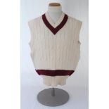 Ian Botham. Queensland Ist XI sleeveless sweater issued to and worn by Botham in his playing career.