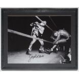 Jake LaMotta. Large mono action photograph of LaMotta knocking out his opponent, sending flying