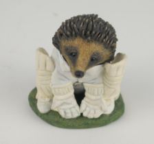 ‘The Hedgehog Wicket-keeper’. A handmade and painted figure of a hedgehog in cricket attire in