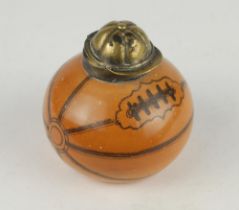 Football inkwell. A Victorian glazed transfer-printed stoneware inkwell, shaped as a slightly