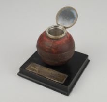 Cricket ball inkwell. The leather cricket ball mounted to wooden base with ink well inserted to