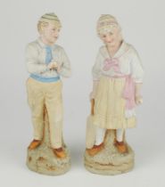 ‘Young England and Young England’s sister’. A pair of continental bisque figures of a boy, wearing