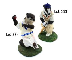 ‘The Otter Bowler’. A handmade and painted figure of a Otter in cricket attire in delivery stride