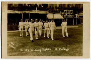 ‘Sussex XI taking the field at Hastings’ 1920. Sepia real photograph postcard for the match Sussex v