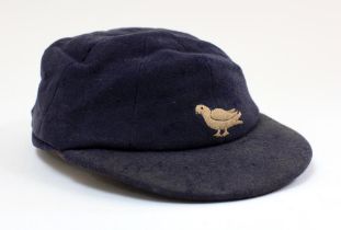 Sussex navy blue 2nd XI cloth cricket cap worn by Robin Marlar during his playing career. The cap,