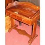 A Victorian mahogany wash stand, having a three-quarter raised gallery over twin frieze drawers,